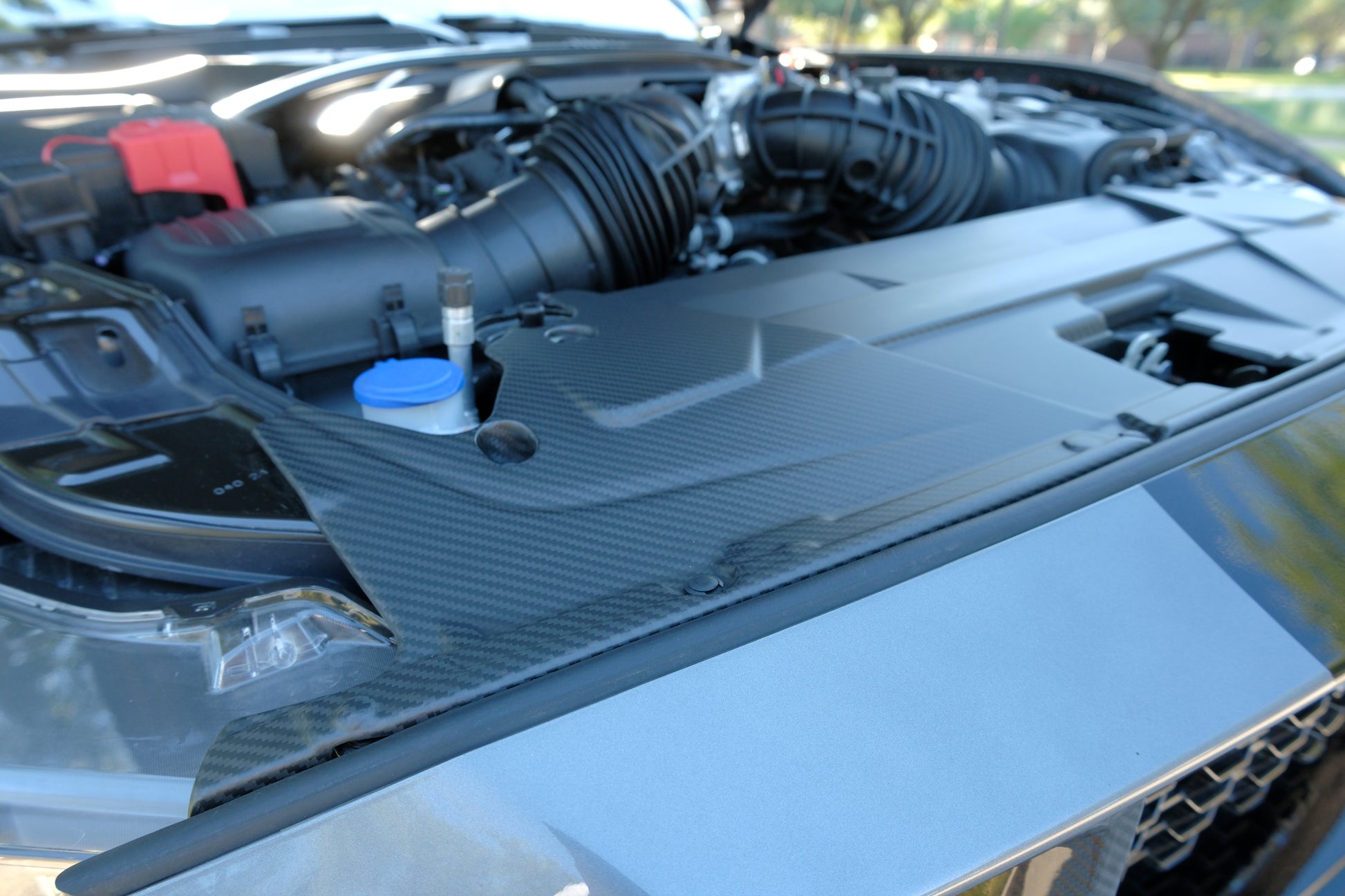 Mustang S650 engine bay with carbon fiber radiator shroud installed